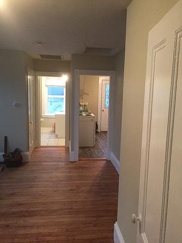 view of kitchen and bathroom from living room