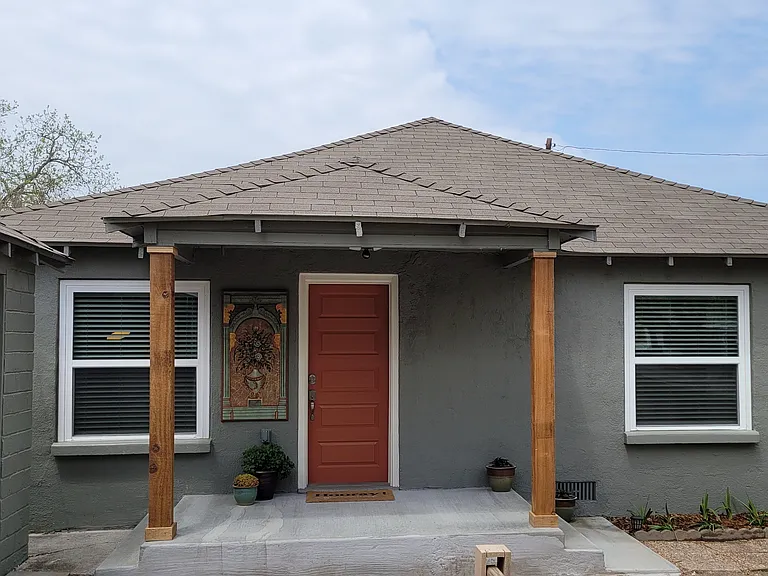 Side porch leading to what could be a bedroom or a second living room.