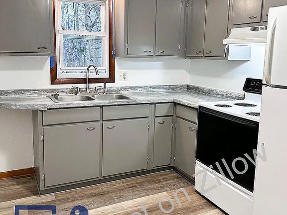 Similar Kitchen, will have more white counter top, window painted white, and all new appliances.