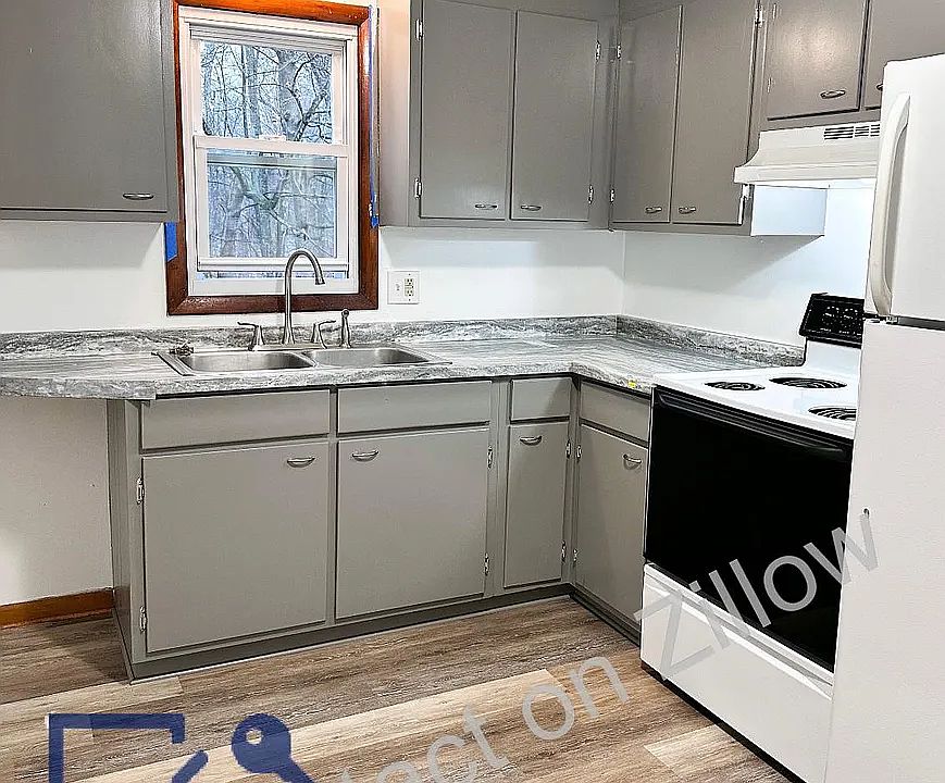 Similar Kitchen, will have more white counter top, window painted white, and all new appliances.