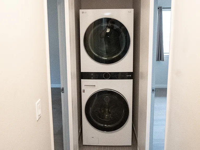 In-unit laundry directly adjacent to bedrooms for convenience