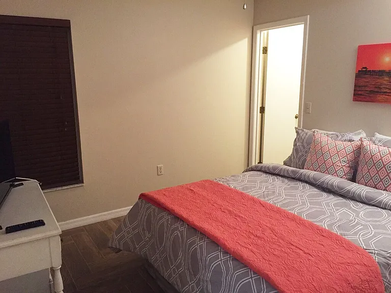 Guest bedroom #2 with walk in closet and located to the back of family room.