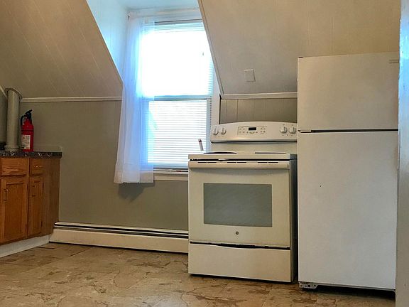 Kitchen with window and appliances less than two years old