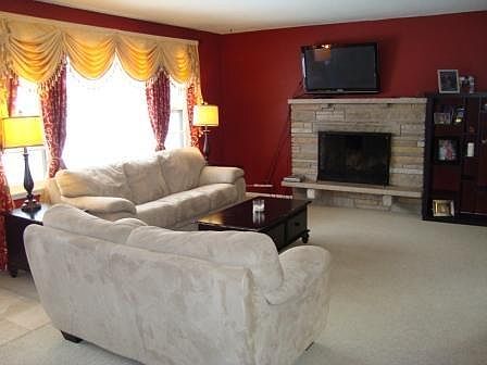 Nice living room with a beautiful working fireplace.