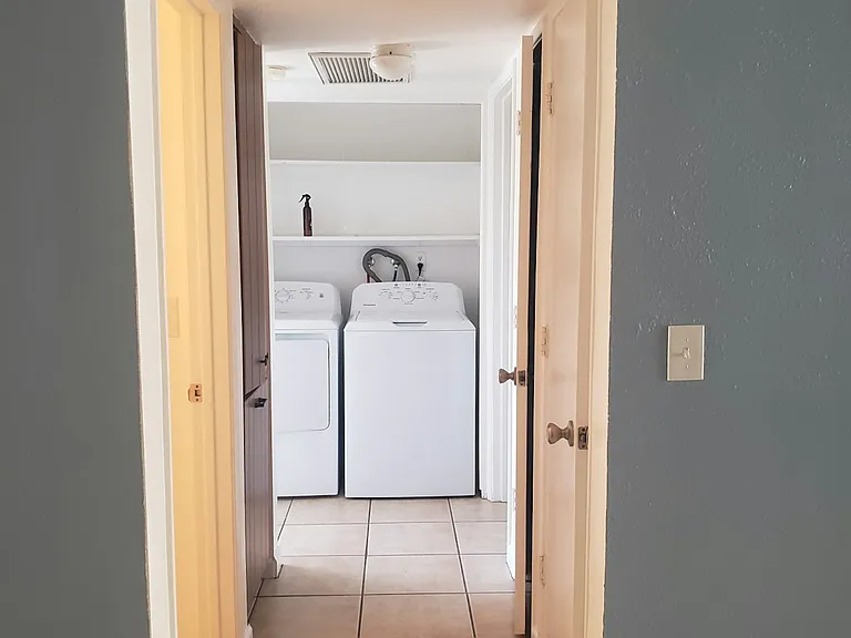 hallway, washer / dryer / cabinet