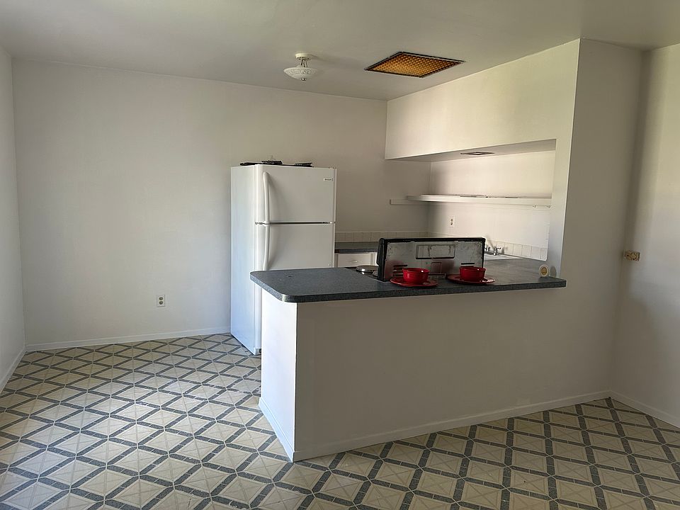 Open kitchen concept. You are around family all the time. A small bar is also available. There is space across from the kitchen to add a small dining table.