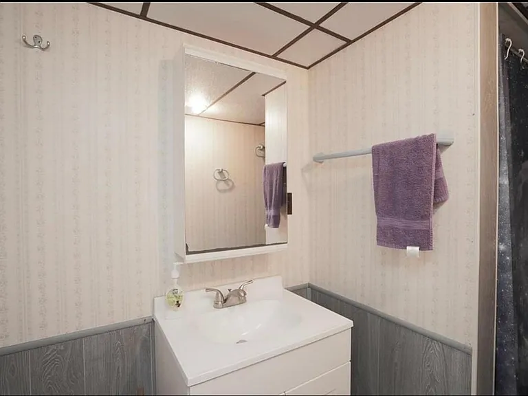 Second full bathroom next to the family room and the washer and dryer. Both bathrooms have a tub/shower combination_great for the kids, great for the adults!