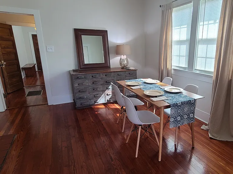 Dining room with table seating for 4 people.