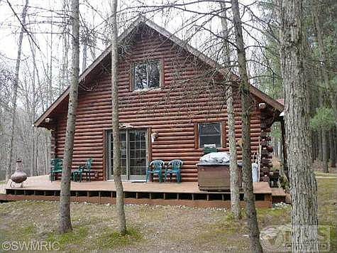 Large wrap around deck with view of Chippewa River.