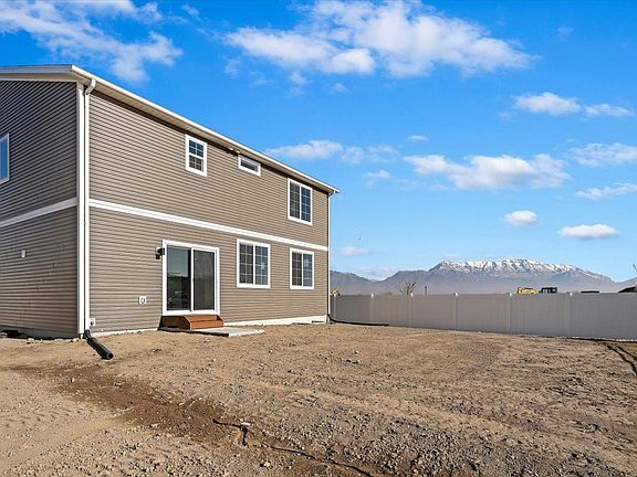 A view of the Exterior of the house and backyard