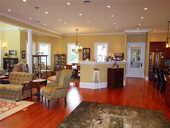 Simple but elegant ceiling lighting, custom Amish cut locust floors with hot water radiant heat and open floor plan make this a 