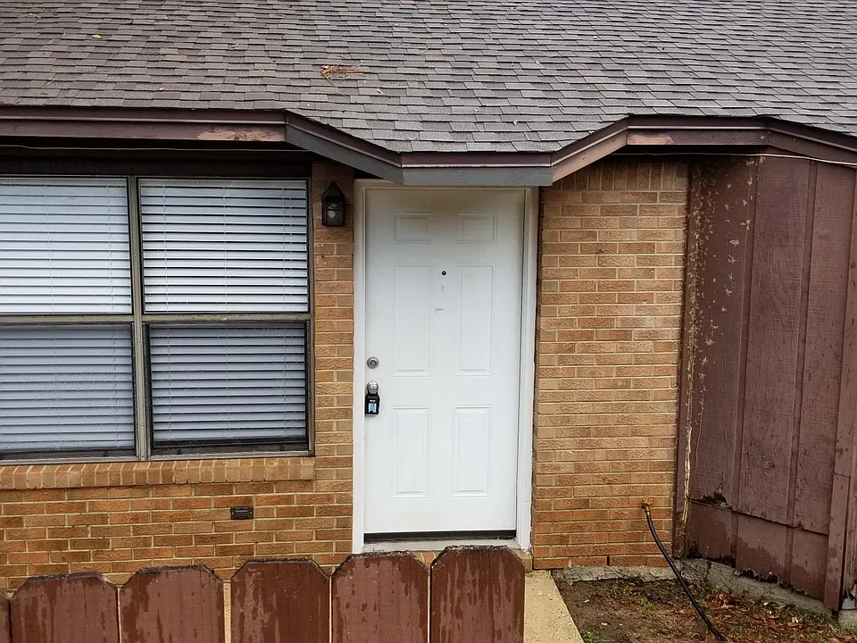 Front entrance. Wood around window has been repaired.
