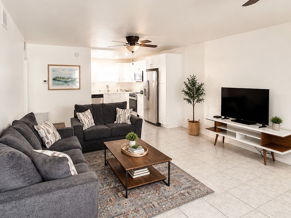 living room with sofa and loveseat