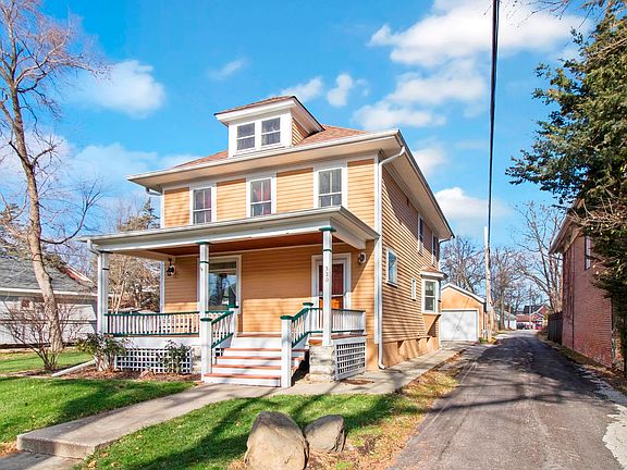 Side alley that leads to the garage and parking around back of house and garage