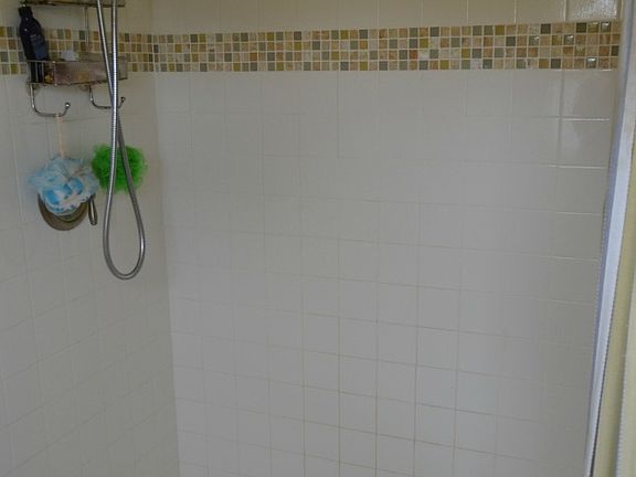 The full bath on the second floor has a ceramic shower, vanity and linen closet.  The flooring is also completed with ceramic tile.  Easy access to all three bedrooms plus a linen closet is right in the bathroom for supplies. 