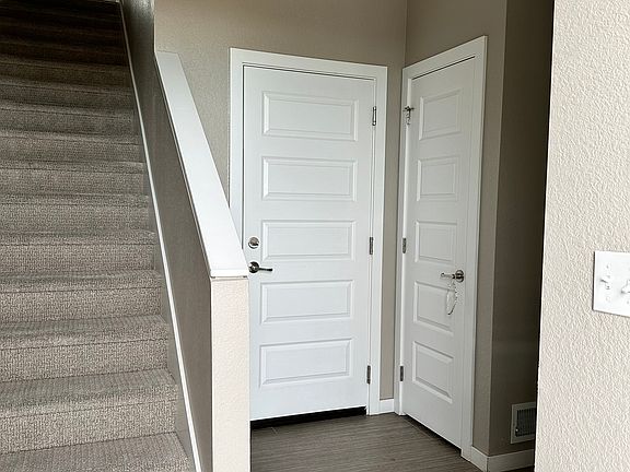 Front entrance leading to attached 2-car garage that including a 240V EV outlet