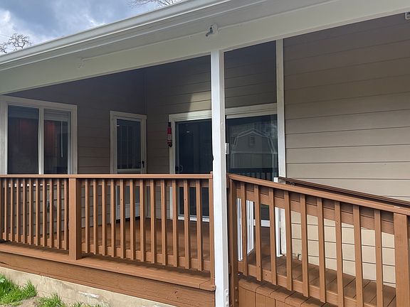 View of deck, master bedroom sliding door, and kitchen window.