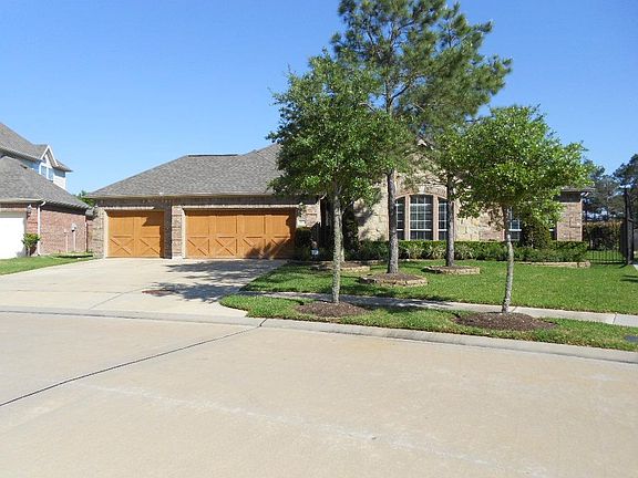 Great curb appeal with mature landscaping throughout