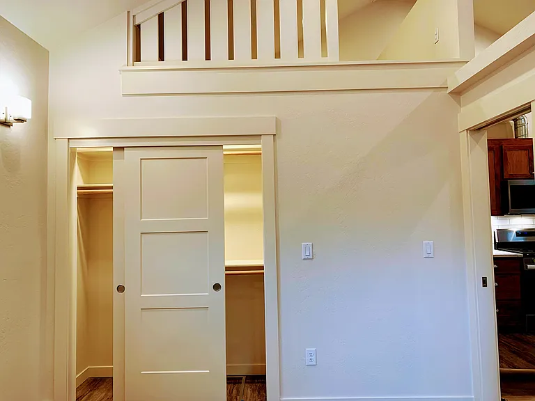View of closet and loft from bedroom.