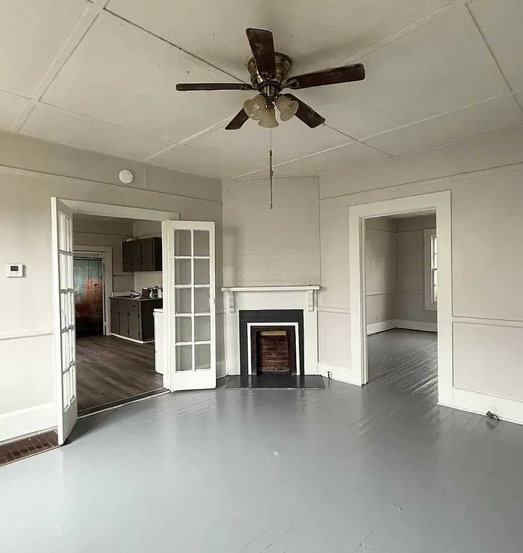 Charming 2-bedroom, 1-bath home in Opelika with a fenced yard, a large front porch, and a back deck. — Photo 4