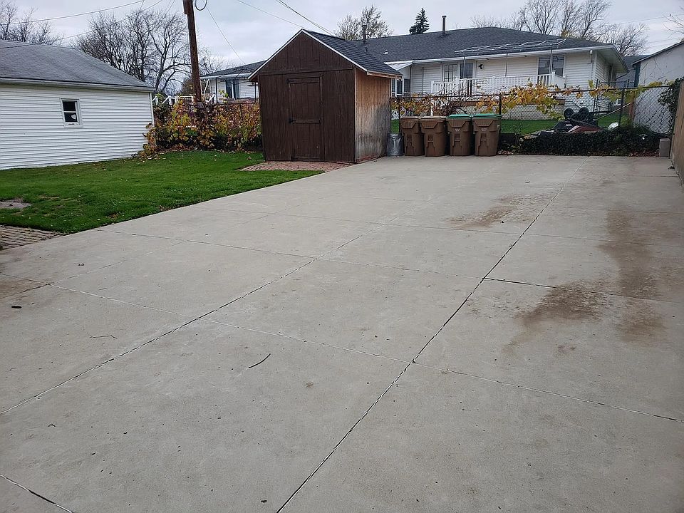 Back yard parking area and shed