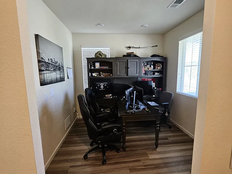 Office to immediate right as you walk in.