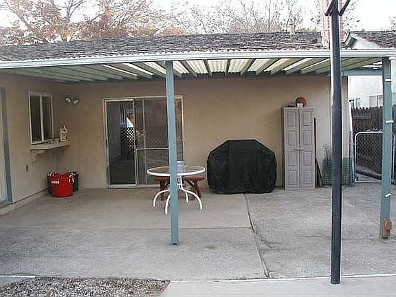 View of back patio from basketball court