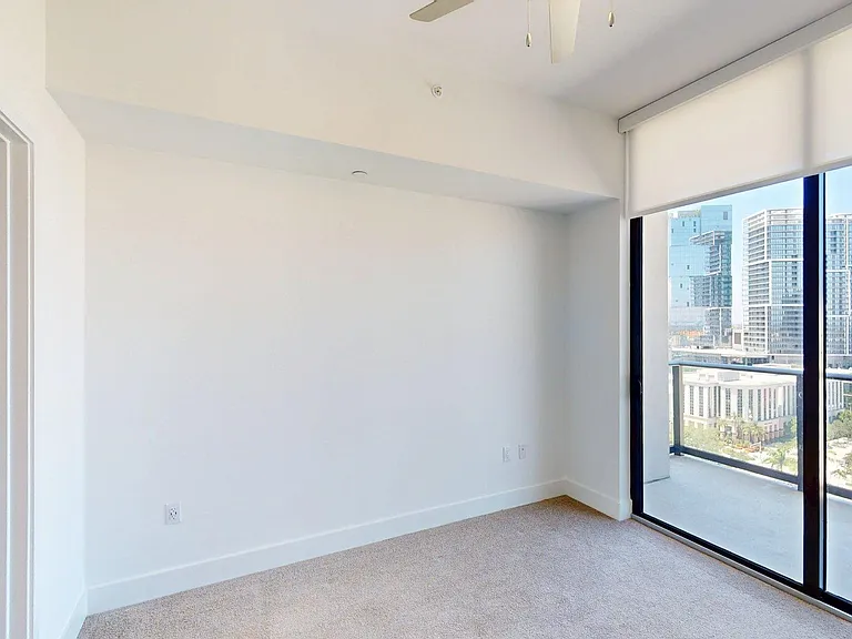 Spacious apartment Bedroom with carpet flooring and Large Closet.