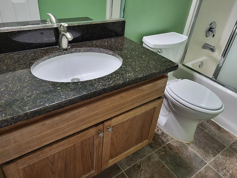 hall bath sink with granite counter