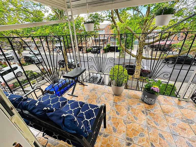 Private covered balcony with comfortable seating_the perfect outdoor space to relax and enjoy fresh air.