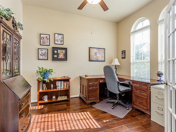 This study is located off of the main entry and is entered through French doors. The room is spacious, has beautiful hardwood floors and windows that overlook the front lawn.