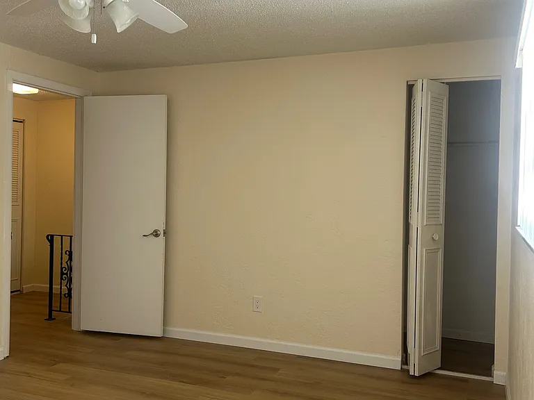 Second Upstairs Bedroom looking back at entry and closet