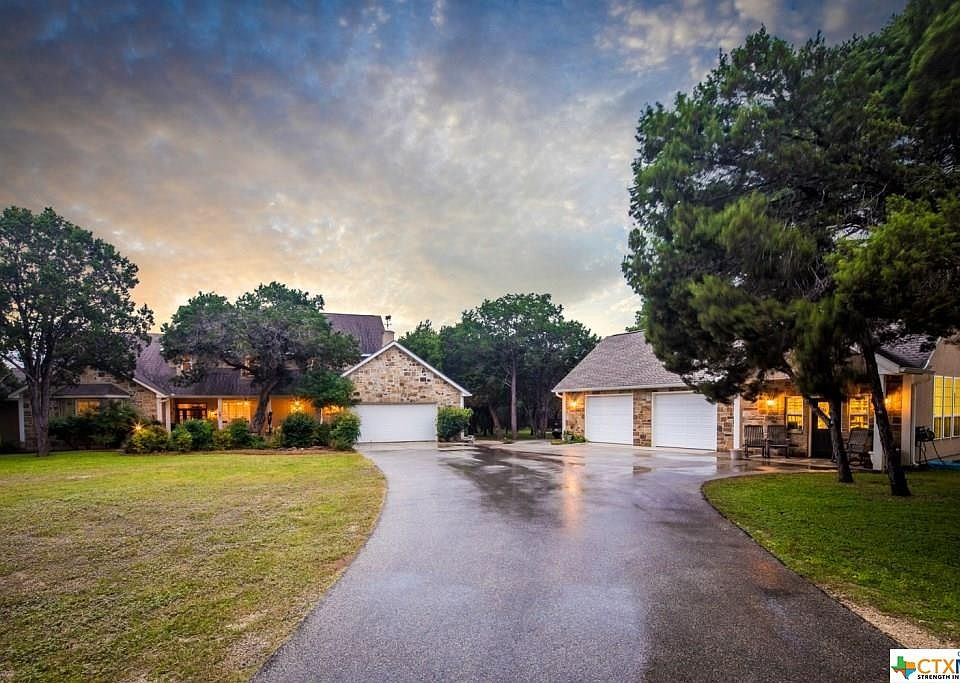 STUNNING CUSTOM HOME WITH 6 BEDROOMS, 5 FULL BATHS AND 2 HALF BATHS. OUTSTANDING REAL WORKING ART STUDI0