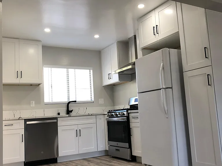 Kitchen has new cabinets, new quartz countertop, designer stainless steel sink, new designer faucet, garbage disposal, new stainless steel appliances.