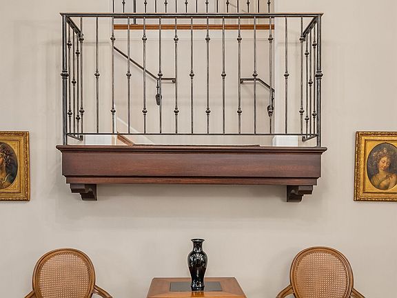 This balcony overlooks the living room.