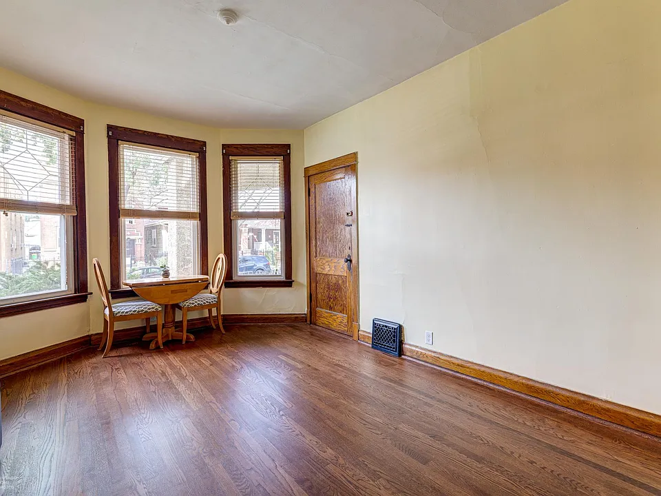 Plenty of windows in the living room with enough space for all your furniture and large tv