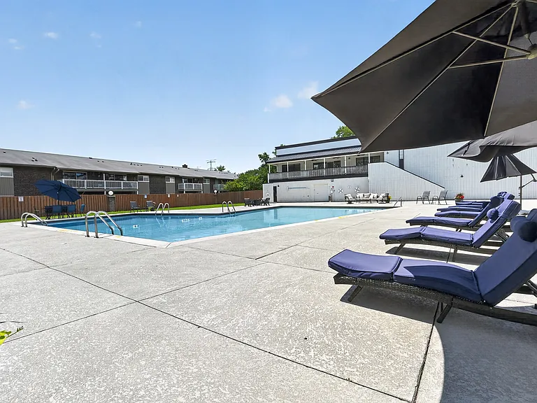 Soak up the sun by the pool featuring comfortable loungers at Renaissance at Carol Stream in Carol Stream, IL.