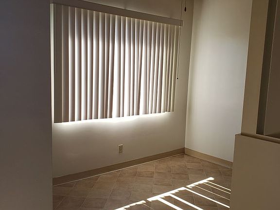 Dining room-with lighted ceiling fan