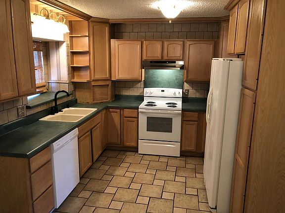 Kitchen with new dishwasher and stove