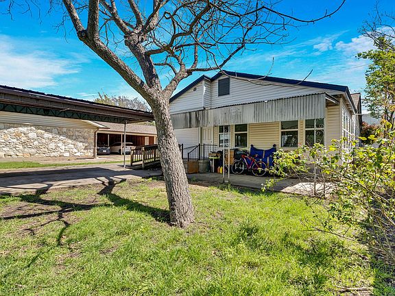 CARPORT AND LARGE COVERED PORCH