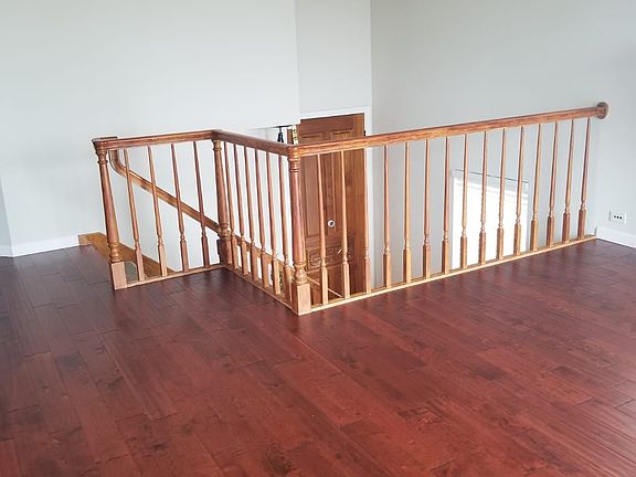 Beautiful hardwood flooring throughout, with a staircase leading to the first floor
