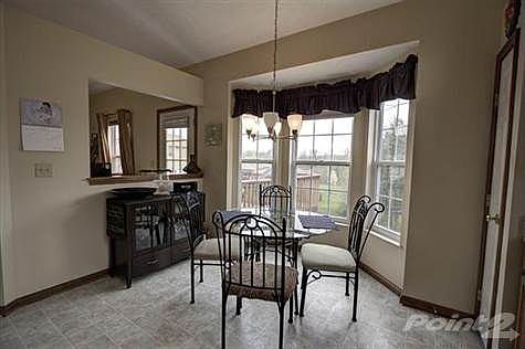 The kitchen has attention to detail and functionality unlike anything the competition has to offer. Take note of the cathedral ceiling and volume this space has to offer. Extra cabinets and a bay window will assure you have all the space necessary. Other features include tile backsplash, palladium window above sink, pass through ledge into the Great room, decorative lighting and a view of the wooded backyard. Set up a showing today and take advantage of this price and the amenities this home has to offer.