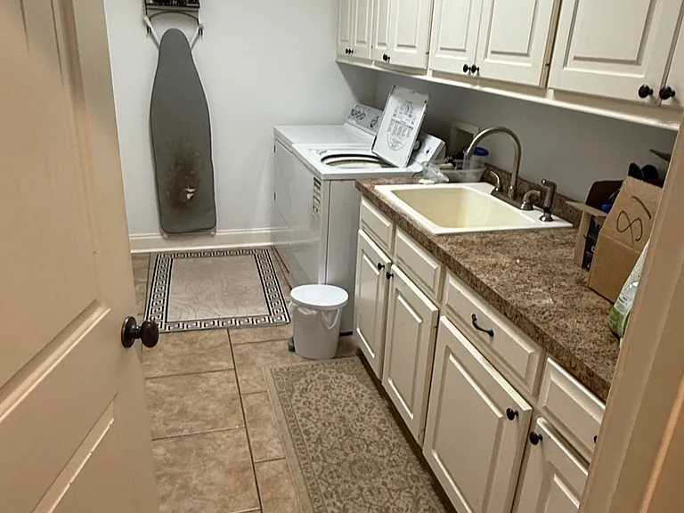 laundry with sink and large storage