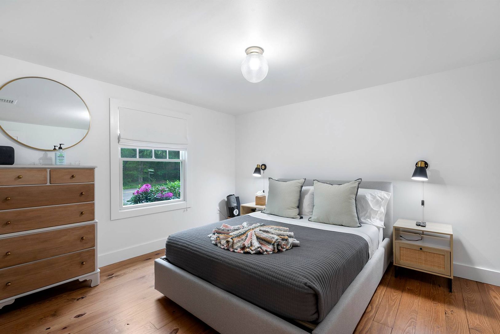  Primary bedroom with queen storage bed, 2 dressers, nightstands with storage and a custom closet.