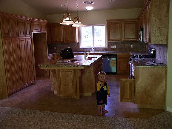 The kitchen and Joshua in February 2005, before we bought the house.