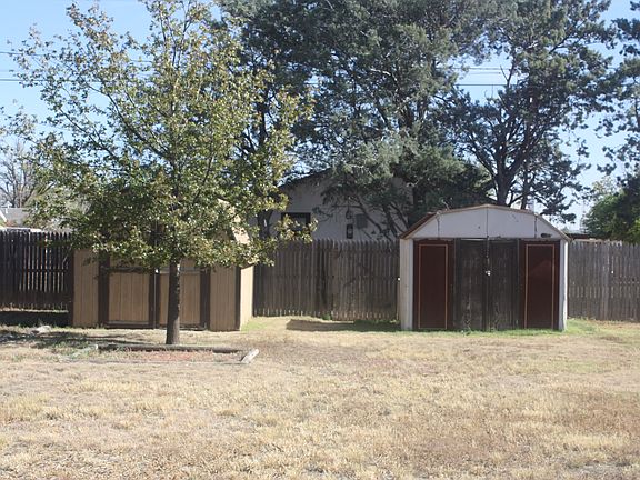 Backyard with 2 sheds