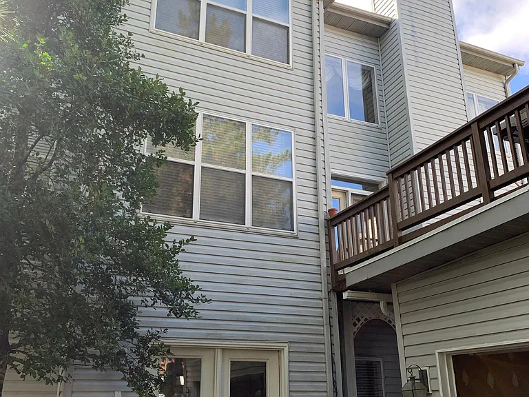 Back entrance, garage, and deck (on garage)