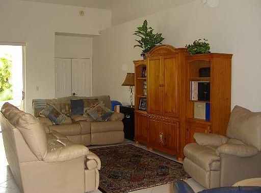 Living room opens to 31'x19' tropical patio.