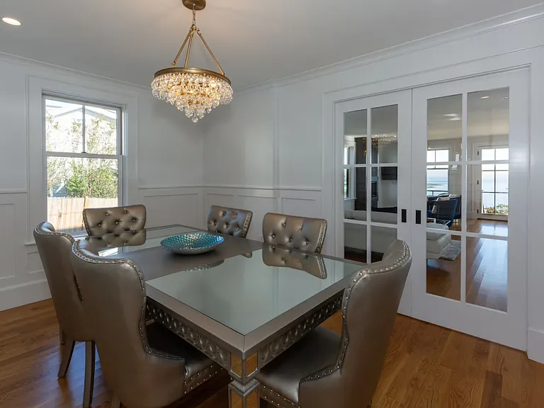 Elegant dining room with sliding French doors