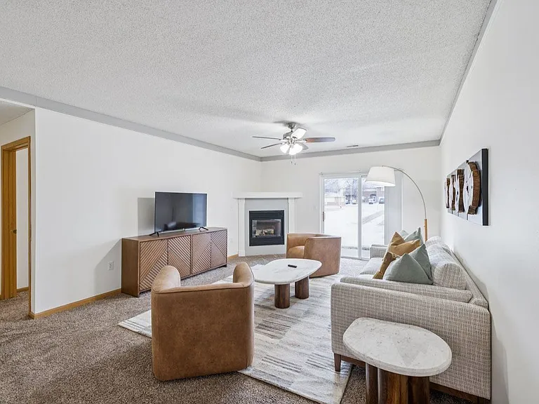 Our spacious living rooms are perfect for relaxing by the cozy fireplace, creating a warm and inviting space for everyday living.